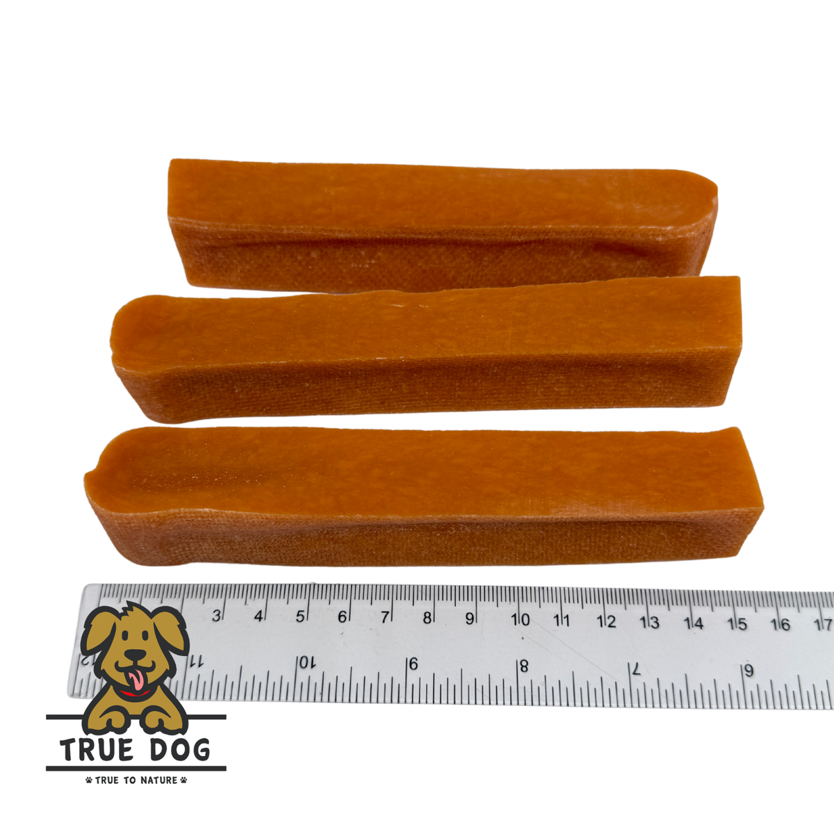 Three True Dog Yak Chews next to a ruler to show a rough length of 15cm.